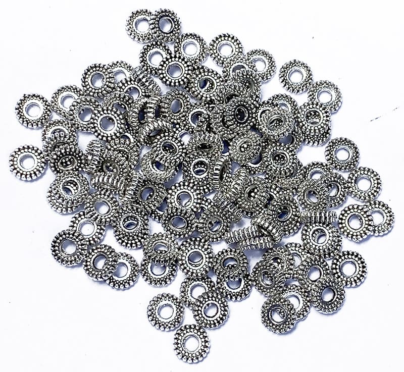 Espaciador de metal plateado redondo plano 6mm x100