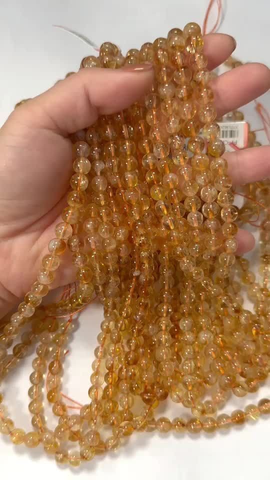 Cuentas AA de citrino calentadas de 6.5 a 7.5 mm en un hilo de 40 cm